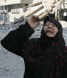 Wailing Arab woman outside her allegedly bombed home on 26 July 2006.